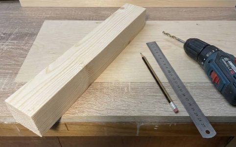 Different types of wood screws laid out on a workbench for comparison