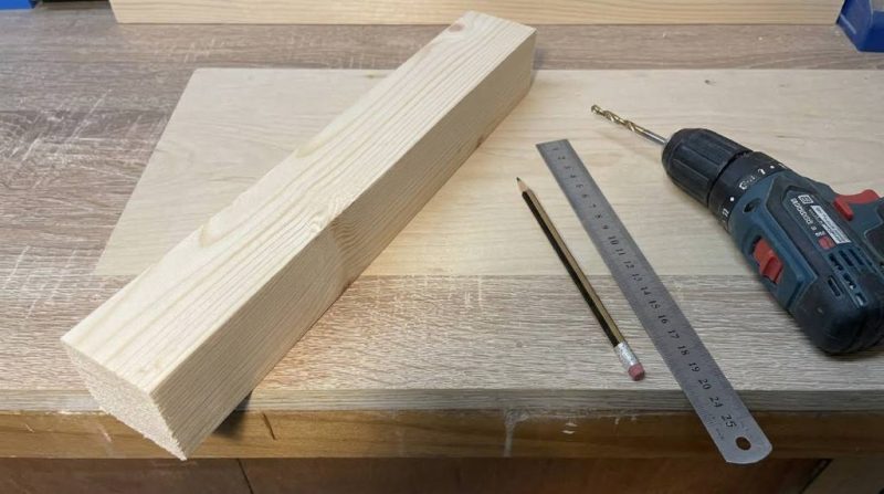 Different types of wood screws laid out on a workbench for comparison